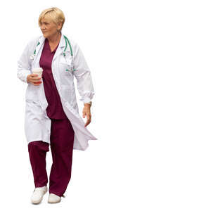 cut out female doctor with a coffee cuo in her hand walking hastily