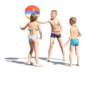 three cut out kids playing with a ball at the beach