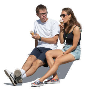 cut out man and woman sitting and eating ice cream