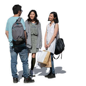 cut out three young asian people with shopping bags standing and talking