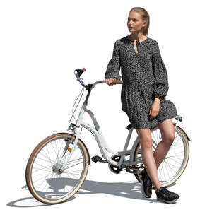 cut out young woman standing and leaning on her bicycle