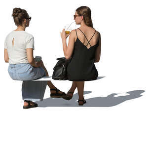 two cut out women sitting and drinking smoothies