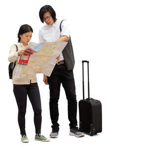 cut out asian tourists standing and looking at a city map