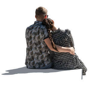 cut out backlit couple sitting and holding each other