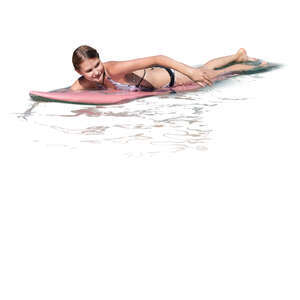 cut out woman paddling on a surfboard