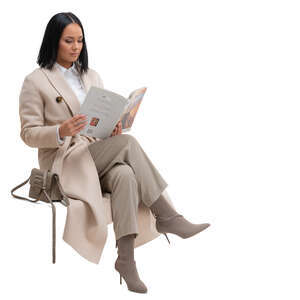 cut out woman in a long beige overcoat sitting and reading