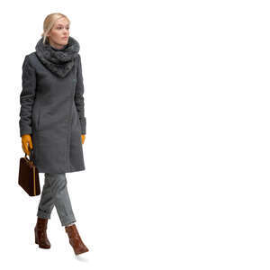 cut out woman in a grey overcoat walking