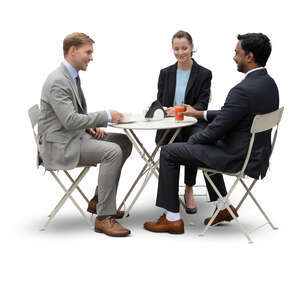 three cut out businesspeople having a business meeting in a cafe