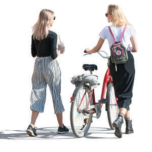 two women with a bike walking and talking