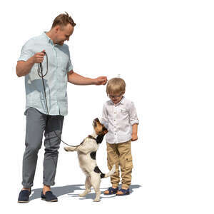 cut out father and son standing and playing with a dog