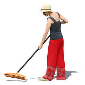 woman raking in a garden