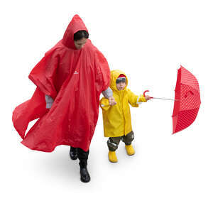 cut out woman with her little son walking in the rain seen from above