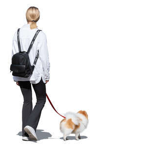 cut out woman walking a little hairy dog