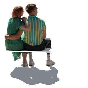cut out young backlit couple sitting