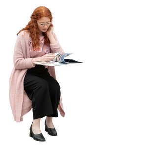 cut out woman sitting at a table and reading a magazine