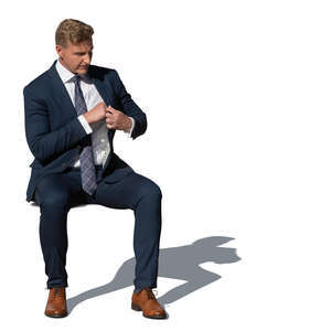 cut out man in a suit sitting outside in the sunlight