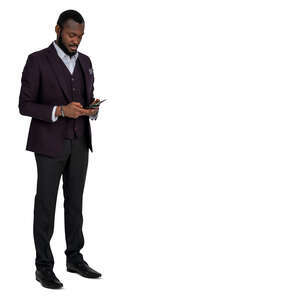 cut out man in a formal suit standing and checking his phone