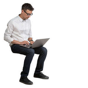 cut out man with a laptop sitting and working