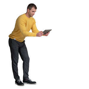 cut out man leaning on a table and looking at a tablet