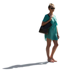 cut out backlit woman in a green summer dress standing