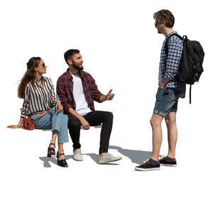 two cut out people sitting and talking to a man standing in front of them