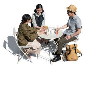 three cut out young people sitting in a cafe seen from above