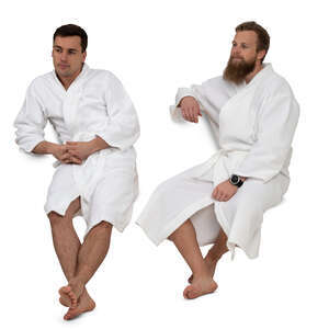 two cut out men in bathrobes sitting in a spa