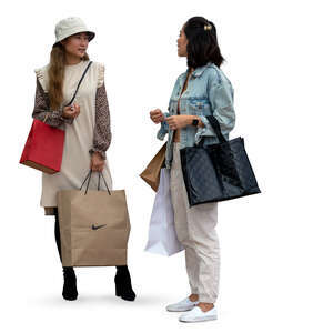 two cut out young asian women with shopping bags standing and talking