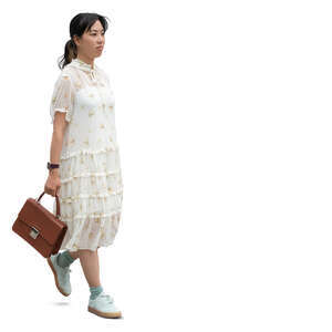 cut out young japanese woman in a white summer dress walking