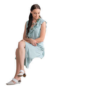 cut out woman in a pale blue dress sitting