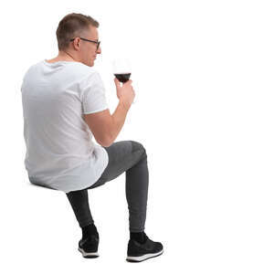 cut out man sitting and drinking wine