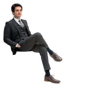 cut out man in a formal black suit sitting
