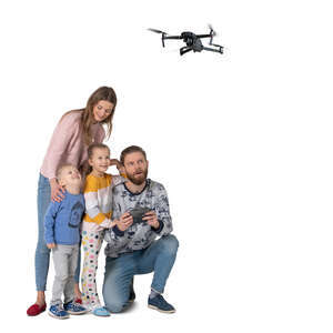 cut out family flying a drone