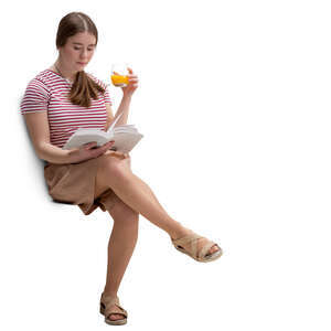 young woman sitting in a cafe and reading