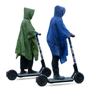 two cut out women wearing raincoats riding scooters