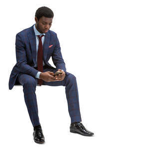 cut out black businessman sitting and texting