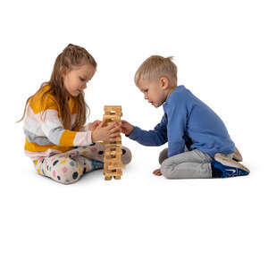 two cut out kids playing on the floor with some wooden toys