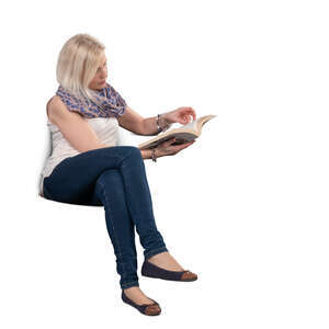 cut out woman sitting on a sofa and reading a book