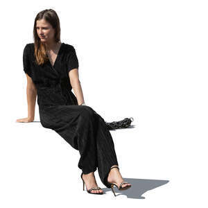 cut out woman in a black jumpsuit sitting