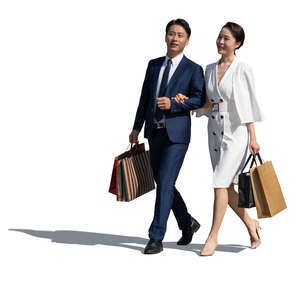 cut out asian couple with shopping bags walking and talking