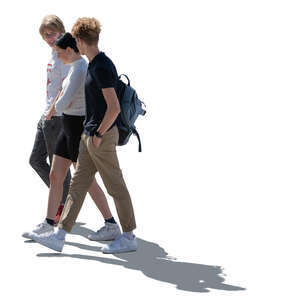 cut out backlit group of three teenagers walking