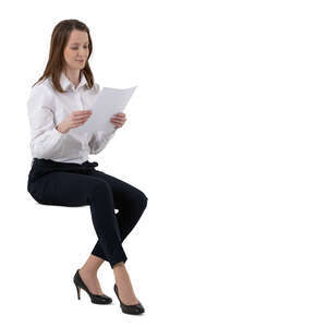 cut out female office worker sitting and reading some papers