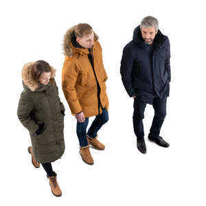 three cut ouut people in winter coats walking seen from above