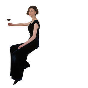 cut out woman sitting at a bar and drinking red wine