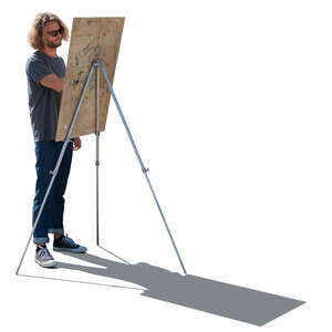 young man standing and drawing