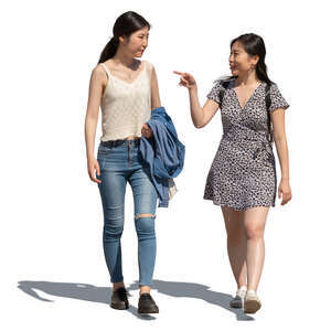 two young asian women walking on a sunny street