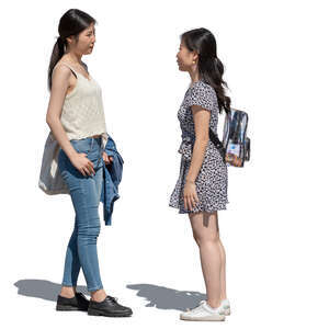 two young asian women standing and talking