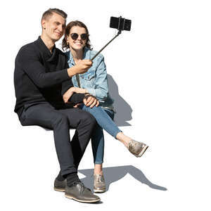 couple sitting and taking a selfie