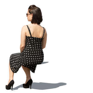 woman in a dotted summer dress sitting