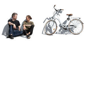 cut out man and woman sitting on a ground and talking